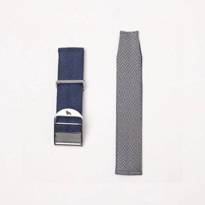 Two RSM watch strap on a white background: blue 2-Piece Silk Strap with silver buckle and textured pattern, and grey lining with micro-adjustable fit.