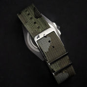 Camouflaged jacquard woven strap with 316L brushed steel buckle, featuring 5 yarn colors: gray, brown, dark green, light green, and brown.