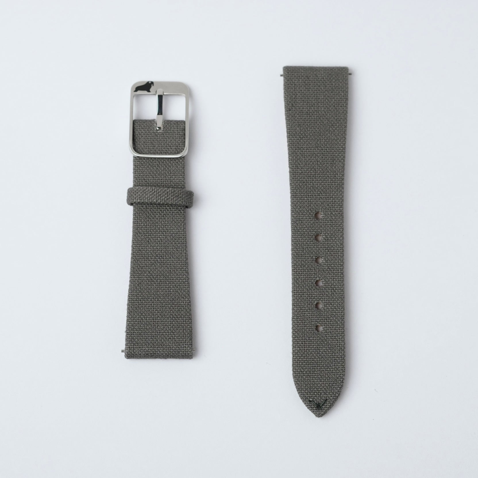 Brunswick Green fabric watch straps by RSM rest on a white surface, featuring minimal stitching, seamless thread details, 316L steel buckle, and fine canvas