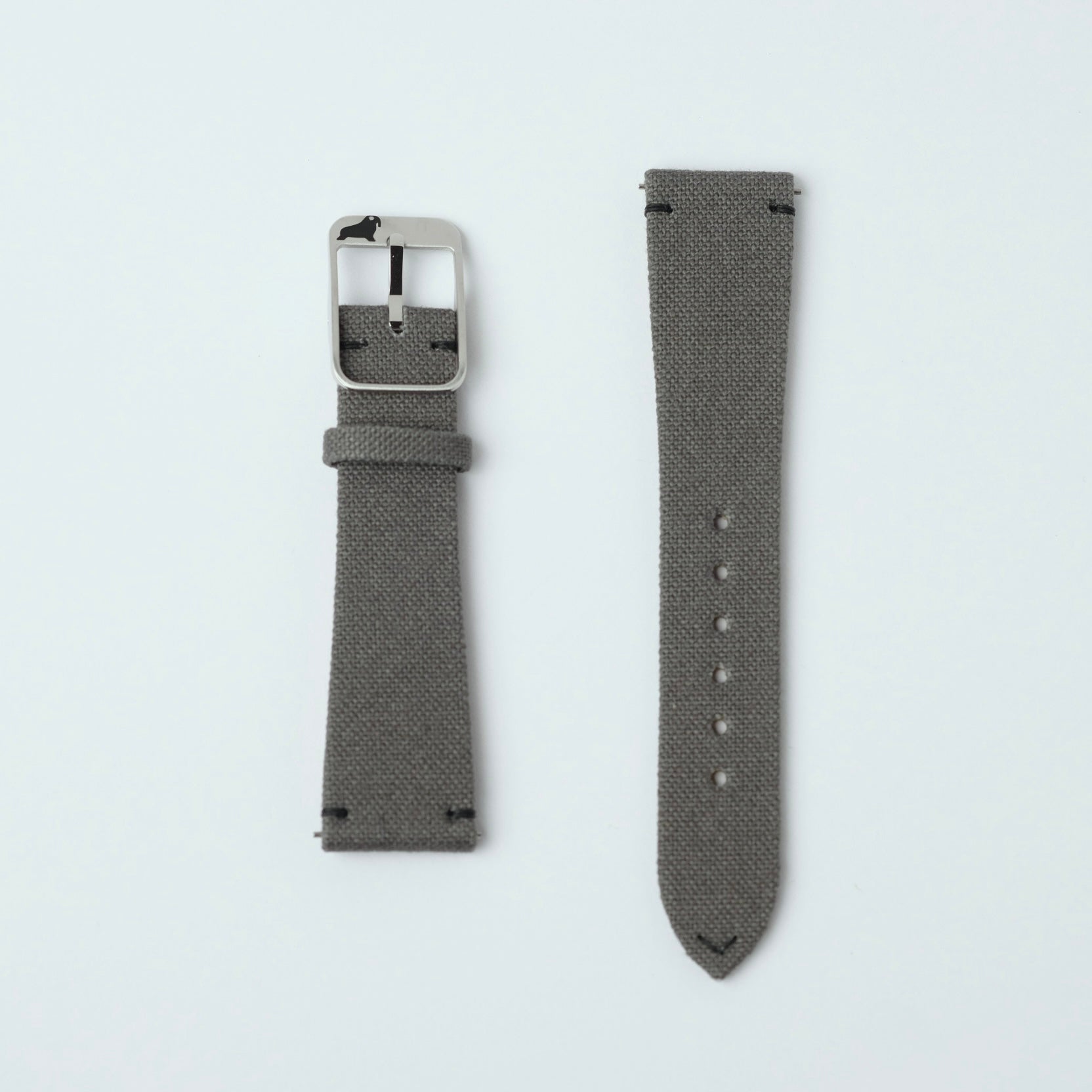 Brunswick Green fabric watch straps by RSM rest on a white surface, featuring minimal stitching, black thread details, 316L steel buckle, and fine canvas.