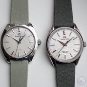 Two Grand Seiko watches with textured dials: SBGY003 with RSM Safari Green canvas strap, SLGW003 with RSM Brunswick Green strap for a refined look.