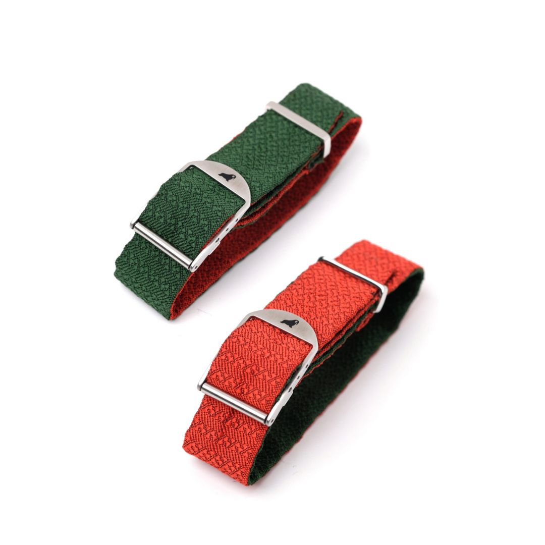 The Reversible Silk Single Pass Strap from My Store features an orange and green chevron pattern with metal buckles, offering versatile style.