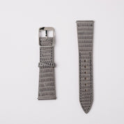 A set of grey Spanish lizard RSM Watch Straps with vertical pattern, featuring a 316L stainless steel buckle and pointed end, showcased on white.