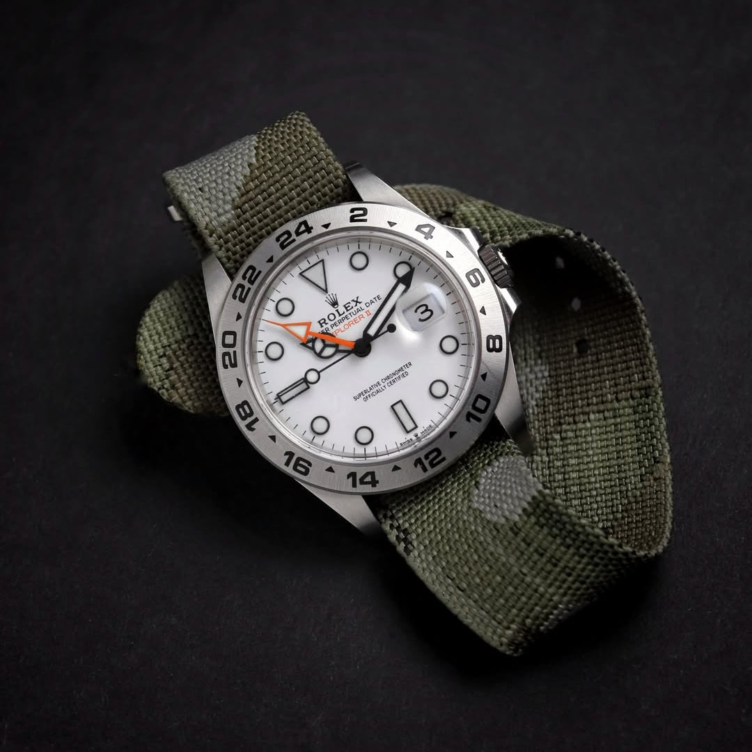 Rolex Explorer 2 Polar dial with orange hand on RSM camo single pass strap. The washable jacquard strap enhances its tool watch design.