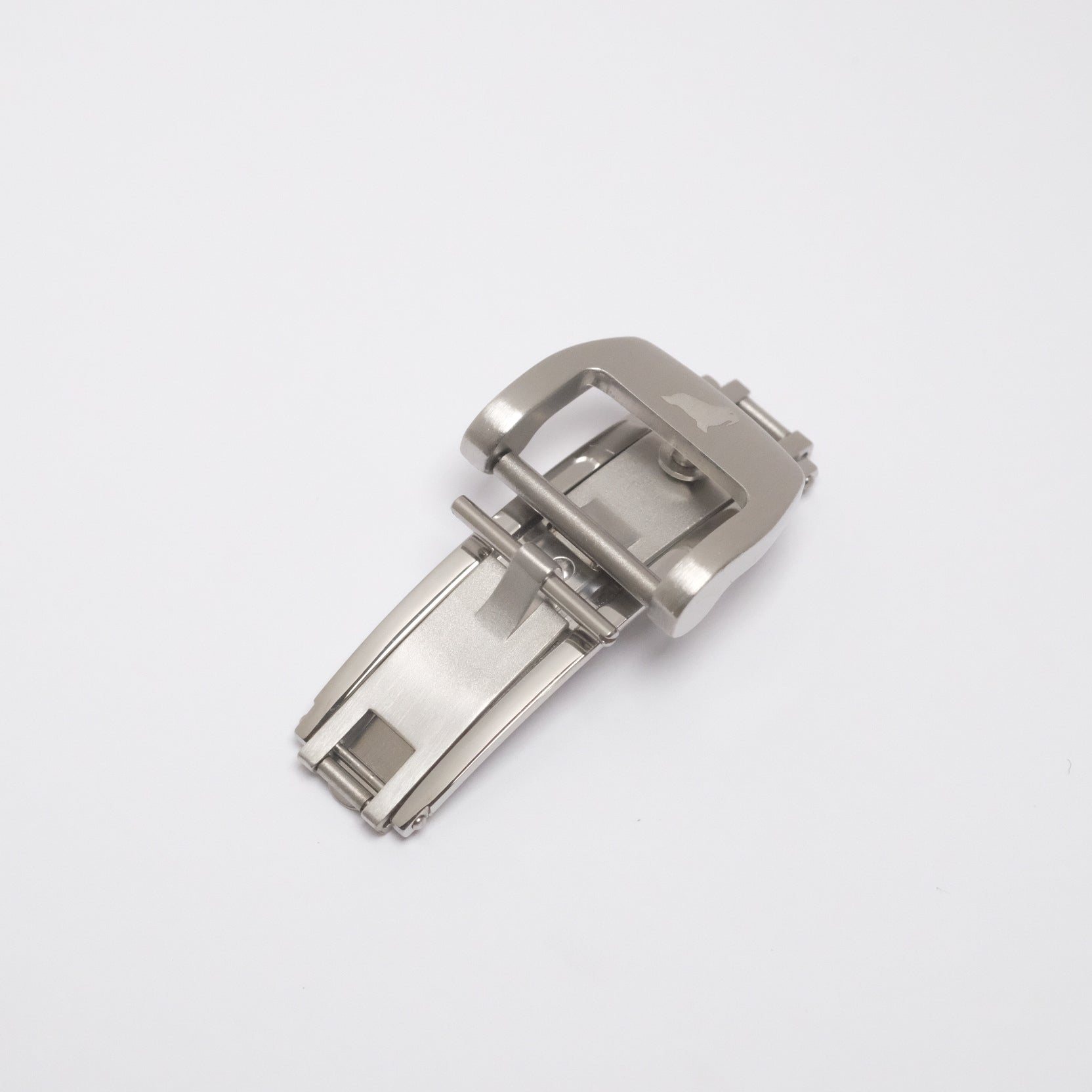 Stainless steel deployant clasp (double fold) in closed position, with spring-loaded blades and RSM Walrus logo for secure closure.