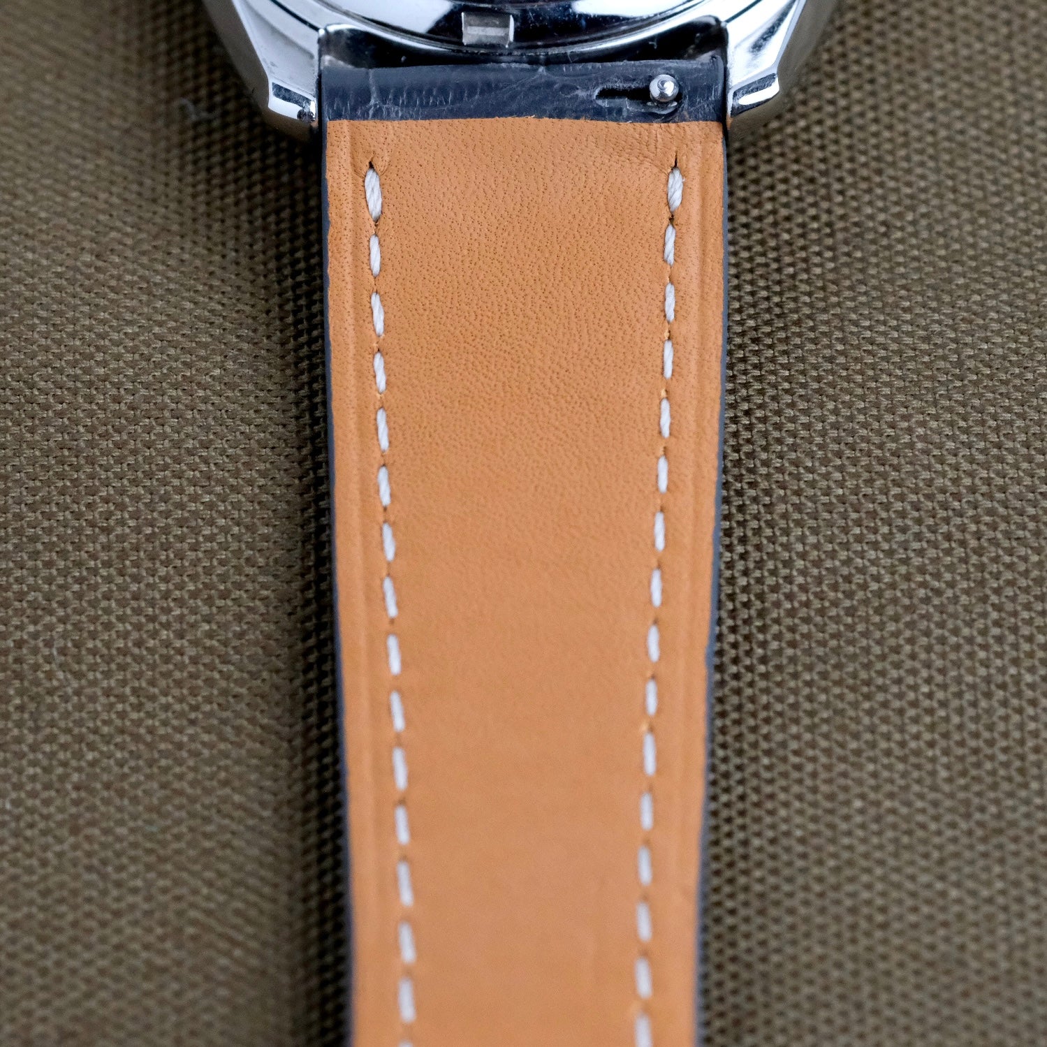 The back of RSM's alligator leather watch strap displays precise stitches and score lines, highlighting superior craftsmanship with a quick-release spring bar.